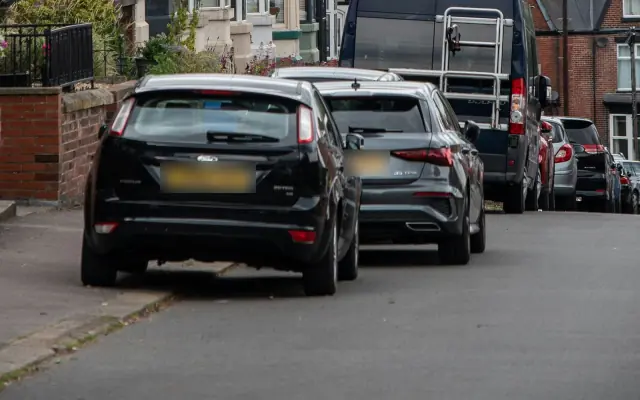 Everyday cars parked on a terraced street