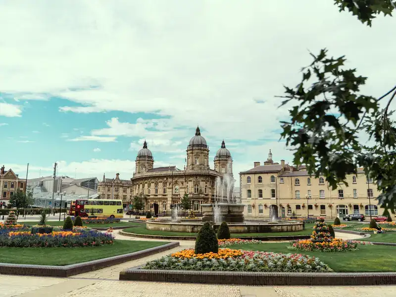Hull Maritime Museum's domed building behind the fountain and flower beds of Queen's Gardens in Hull