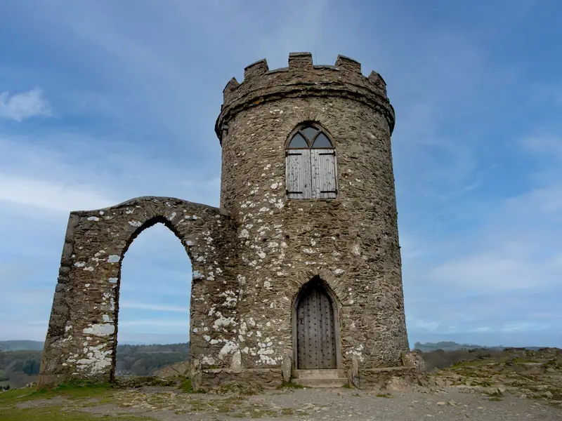 Old John Tower in Bradgate Park, Leicester, under a blue sky