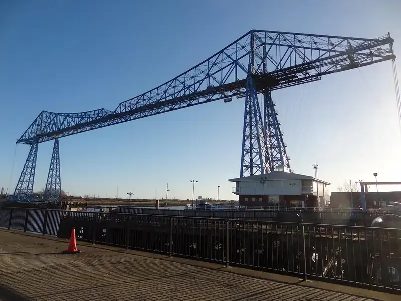 The blue steel Transporter Bridge over the River Tees in Middlesbrough under a clear sky