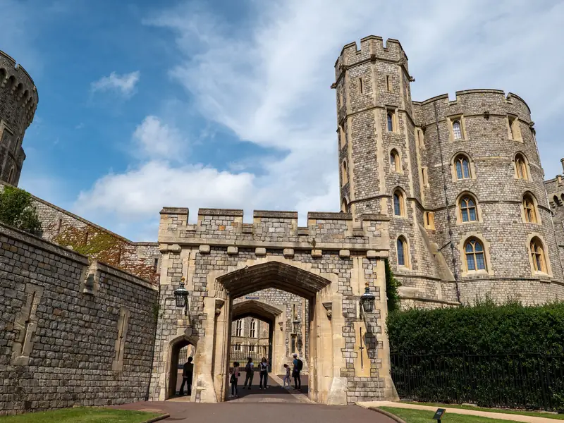 Windsor Castle under a blue sky, just across the Thames from Slough